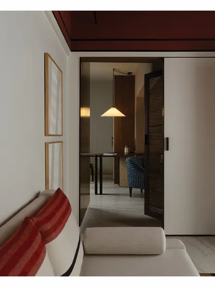 A view from a lounge area into a study. Every piece of furniture in this home, from the tables to the wardrobes and even some lights, was custom-made to give each room its own distinct yet cohesive individuality.