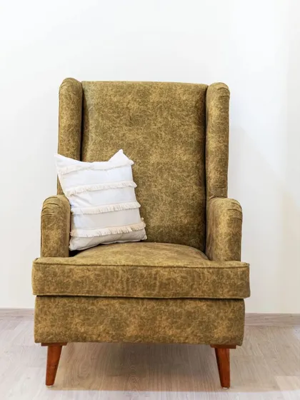 Our custom-made wingback chair, upholstered in a beautiful textured fabric. With its high back and classic silhouette, it’s the perfect armchair for creating a cozy reading nook.