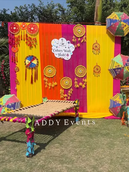 A traditional and colorful photo booth created for a Holi celebration. Featuring a charpai (woven cot), bright drapes, and festive hangings, this setup provides a perfect, on-theme spot for employees to take memorable photos.