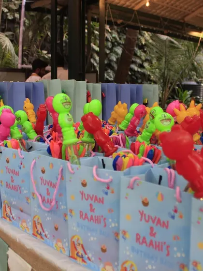 An Aqua Adventure themed Holi party. I created a gift shop with return favors, piñata goodies, and game prizes, including these colorful goodie bags.