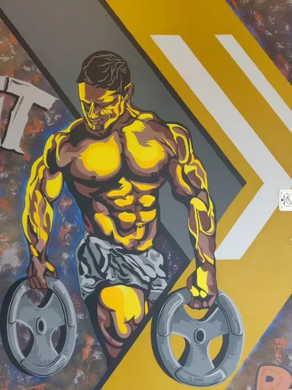 A close-up of the bodybuilder figure from our graffiti mural at One More Rep gym. The stylized, high-contrast look is designed to be motivating and energetic.