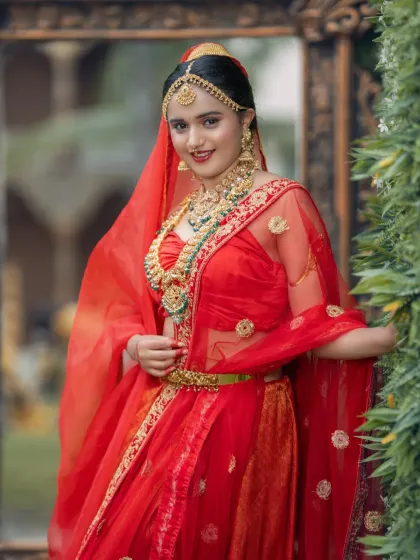 This shot shows the beautiful flow of the lehenga and dupatta. I work with the bride to ensure her entire look, from head to toe, is perfect.