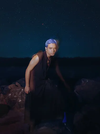 An artistic shot from an editorial project where I handled men's grooming. The concept involved creating a futuristic look with bold, temporary blue hair color that stands out against the dark, atmospheric background.