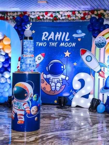 The "Two the Moon" space-themed birthday party decor, a creative and fun setup for a 2-year-old.