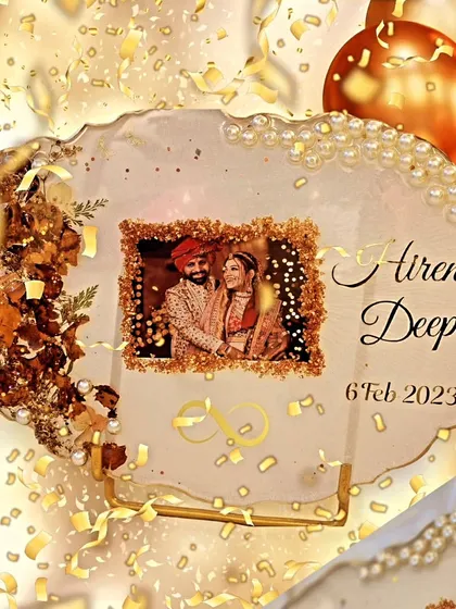 This anniversary gift was made using the couple's varmala flowers. The geode-style plaque features their wedding photo, names, and wedding date, surrounded by preserved petals, gold leaf, and a delicate pearl border.