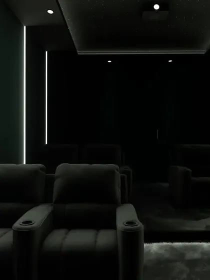 A dark and moody theater design, where the only light comes from the subtle LED strips, creating a pure, distraction-free cinema environment.