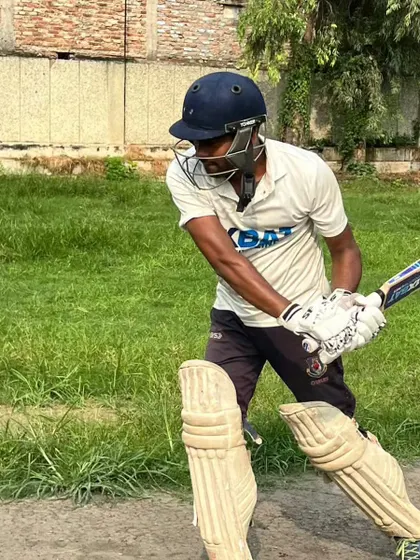 A player demonstrates a solid defensive stance, ready to face the bowler. We teach both attacking and defensive cricket skills.