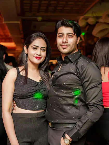 A couple enjoying the night out, dressed to impress for our throwback jams and timeless moves.