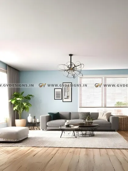 This living space is open, airy, and full of natural light. We used a light blue wall color, a comfortable grey sofa, and plenty of indoor plants to create a room that feels vibrant, comfortable, and connected to nature.