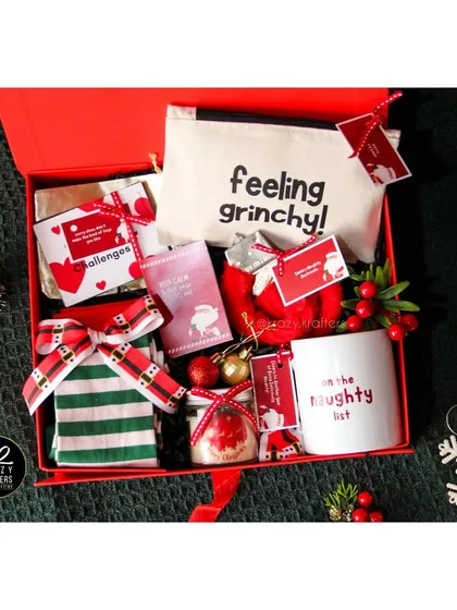For the one on the 'naughty list'! This cheeky Christmas hamper includes naughty coupons and a 'Feeling Grinchy' pouch.