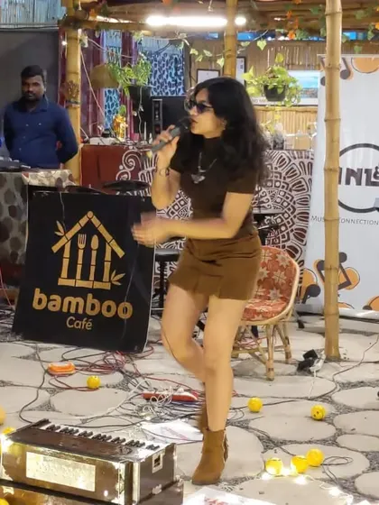 Performing an acoustic set at a cozy cafe event. This photo shows the intimate and casual setup, perfect for smaller venues and audiences who want to connect with the music.
