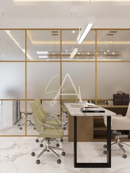For this private cabin, we used gold-framed glass partitions to maintain an open feel while ensuring privacy. The design combines a sleek marble-top desk with minimalist chairs, creating a bright and modern executive office.