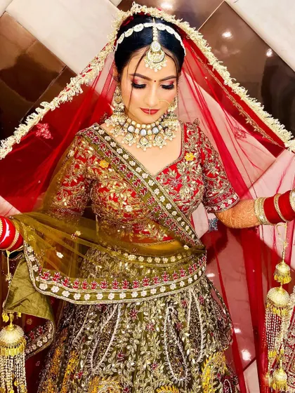 This bride looks stunning while adjusting her dupatta. The makeup is bold yet elegant, perfect for making a statement.