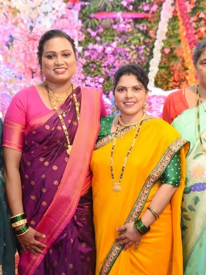 A group portrait of the women of the family, dressed in colorful sarees for the naming ceremony.