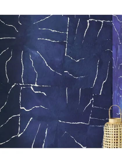 This wallpaper celebrates the raw characteristics of paper, from its reliefs to its veins. The deep indigo dye and crackled pattern create a stunning, organic texture that feels both ancient and modern.