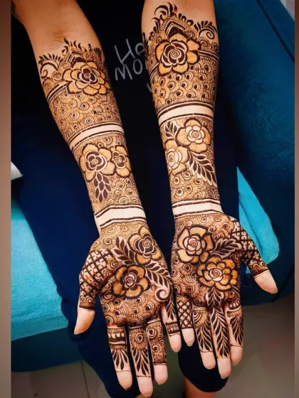 Another look at the full-arm rose design, showing how the pattern creates a cohesive and stunning bridal statement.