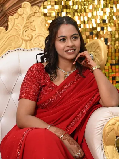 Posing like a queen on the wedding throne! This bridesmaid looks so elegant and happy.