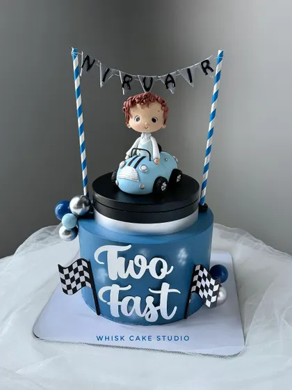 A still shot of our moving car cake. This design is perfect for a car-loving toddler's second birthday party.