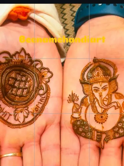 A simple yet powerful design for a groom. One hand has a portrait of Lord Ganesha for blessings, and the other has the couple's names.