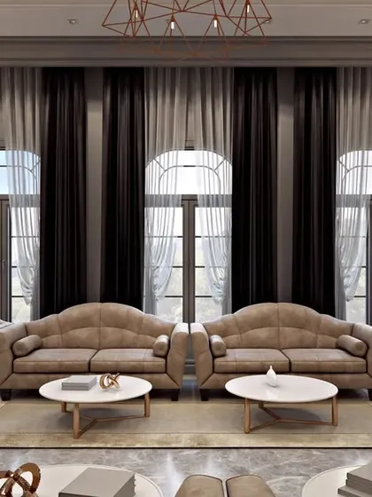 A view of the drawing room's tall, arched windows dressed in heavy curtains, emphasizing the room's grand proportions.
