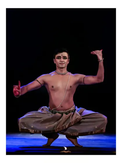 A powerful 'aramandi' or half-seated pose from a solo performance. This fundamental stance requires immense strength and balance.