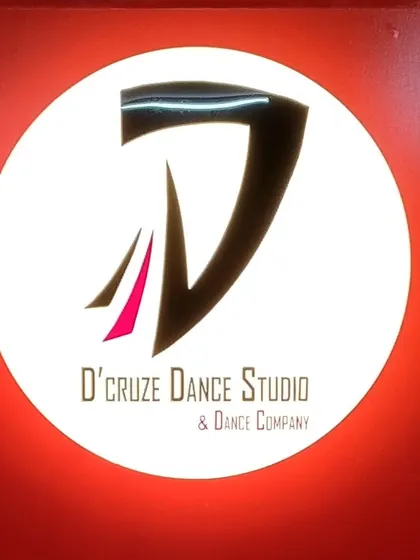 A close-up of our signature backlit logo. It adds a professional and energetic touch to the studio, making it a great branding element for anyone filming content here.