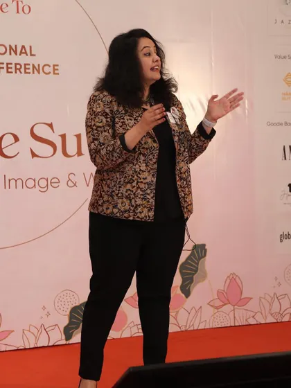 Here I am, speaking at a national conference on how to command the stage with confidence. My leadership presence coaching helps managers and executives own the room, connect with their audience, and deliver their message with authority and authenticity.