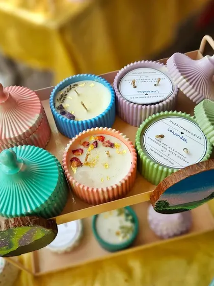 A beautiful display of my candles with lids, featuring different colors and jar styles. The lids help preserve the fragrance and keep the wax dust-free. These make for a wonderful, complete gift set.