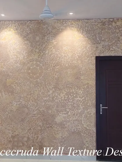 This is another example of our popular Calcecruda wall texture, applied here as a full accent wall. The subtle, earthy texture and integrated patterns provide a warm and inviting feel, beautifully illuminated by spotlights.