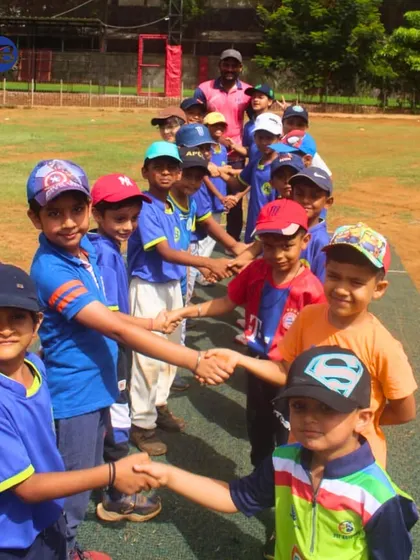 A line of our young cricketers shakes hands, a classic display of sportsmanship. We teach our players to respect their opponents and the game itself.