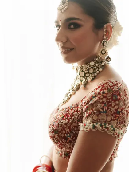 A beautiful side profile of a bride with a classic floral bun.
