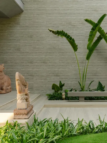 These images show the house as a living space, with glimpses of the pool, lawn, and even the family dogs, grounding the monumental architecture in everyday life.