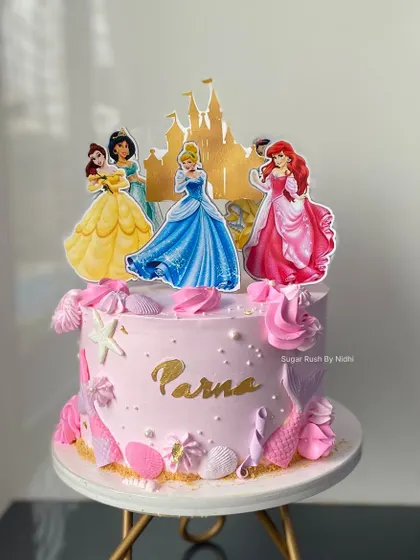 Why choose one when you can have both? This cake combines a princess and mermaid theme, featuring a castle topper and mermaid tail decorations for the ultimate fantasy birthday.