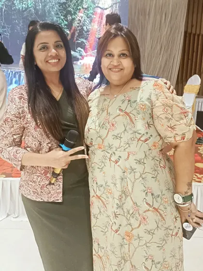 With a happy client at a 70th birthday bash I hosted. The event was a huge success with an unplugged band, fun games, and a DJ night.