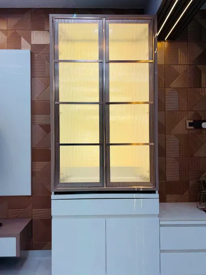 When closed, the mandir unit appears as an elegant, backlit display cabinet, maintaining a modern aesthetic in the living room.