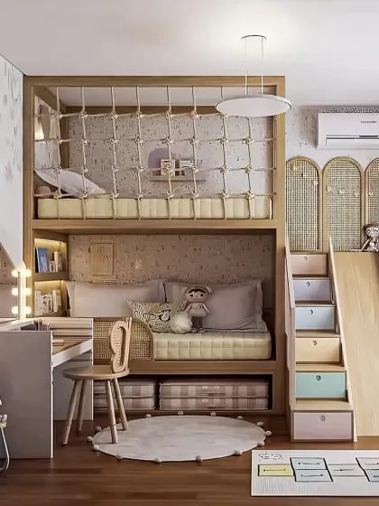 We design imaginative and practical kids' rooms that grow with your child. This custom-built unit includes a bunk bed with a safety net, a fun slide, integrated storage drawers, and a dedicated vanity and study desk.