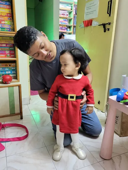 A sweet moment between a dad and his little girl, dressed beautifully for her visit. Our library is a welcoming space for even our tiniest members to explore and feel at home.