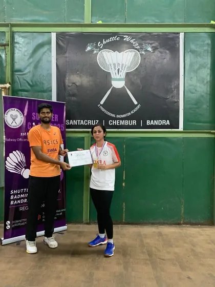 A player from our Bandra West academy proudly displays her medal and certificate. We ensure every student receives recognition for their hard work and participation.