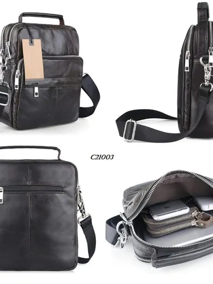 An overview of our compact leather messenger bag, model C21003. This bag features a top handle and a detachable crossbody strap, with multiple zippered compartments designed to securely organize electronics and documents.