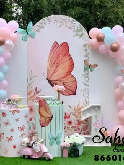 We make children's birthday dreams come true with detailed themed decorations. This butterfly theme features pastel balloon arches, custom backdrops, and themed props that create an enchanting atmosphere for your child's special day.