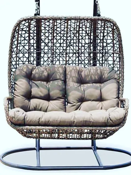 A classic double-seater egg swing with a stand. This is a great option if you can't hang a swing from the ceiling. It’s cozy, comfortable, and can be placed anywhere in your garden or on your terrace.