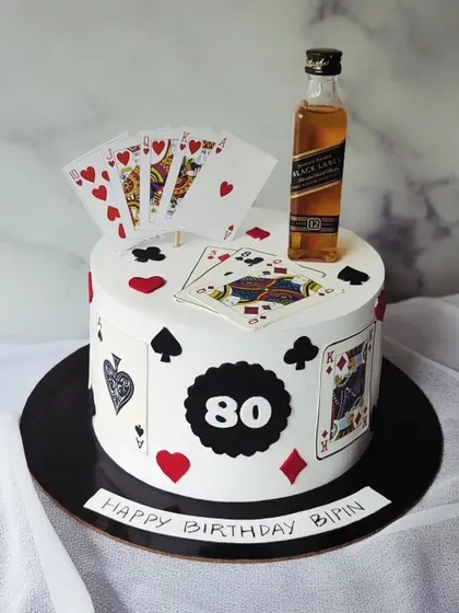 I've got an ace up my sleeve! A fun cake for a card game lover, decorated with playing cards and a miniature bottle of Black Label.
