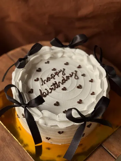 Another look at the popular Pinterest-inspired bow cake, a favorite for birthdays and bridal showers.