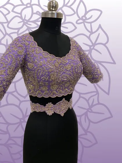 The blouse and belt for the lavender saree set, showing the detailed zardosi embroidery.