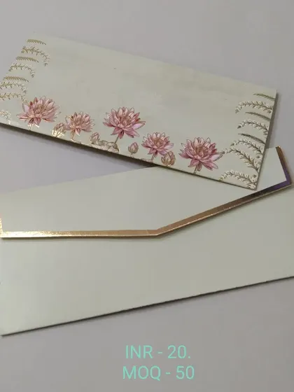 An elegant off-white money envelope with a simple design of pink lotus flowers and gold foil accents. The look is clean, modern, and sophisticated.