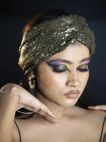 A bold and colorful party look with a graphic, multi-toned eyeshadow design.