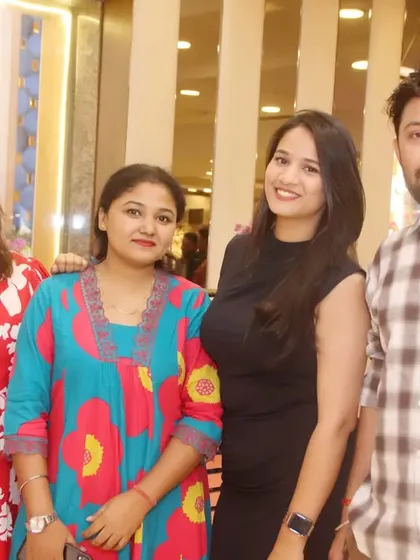 A group of friends and family smiling for the camera at a celebration.