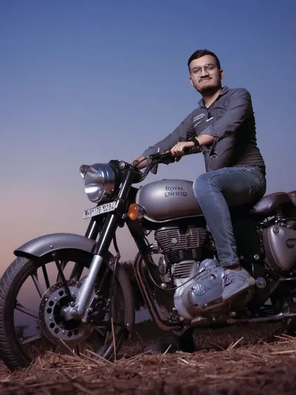 A pre-wedding portrait session with a Royal Enfield during the golden hour. These shoots are a great way to capture your personality in a relaxed, outdoor setting before the main events.