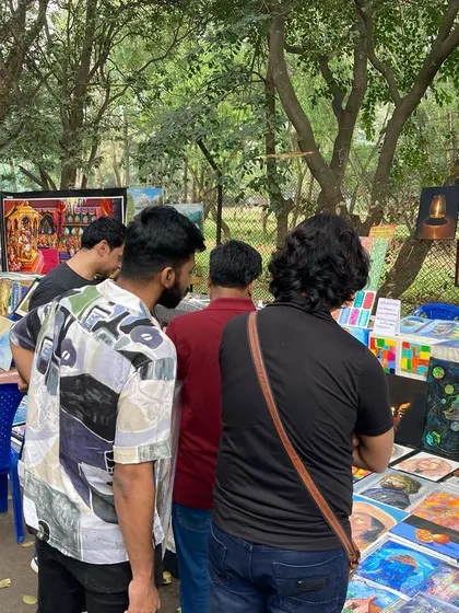 A crowd of people browsing the art at my Chitra Santhe stall.
