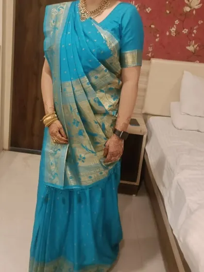 I am always excited to try new styles. This was my first time pre-pleating a Gujarati style saree, with the pallu draped over the front. The result was a convenient and beautiful drape for my client.